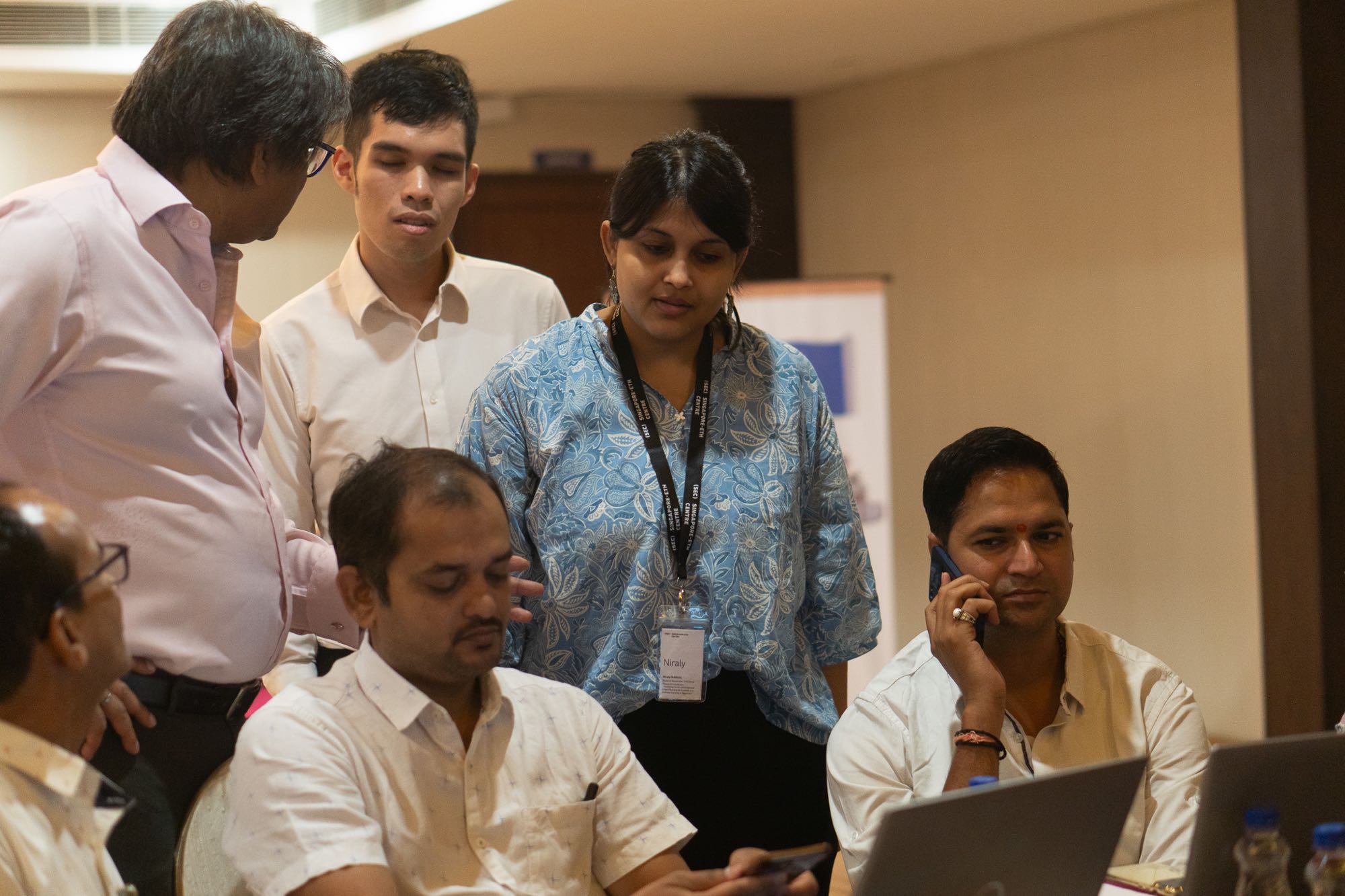 Workshop participants collaborating on data analysis.
